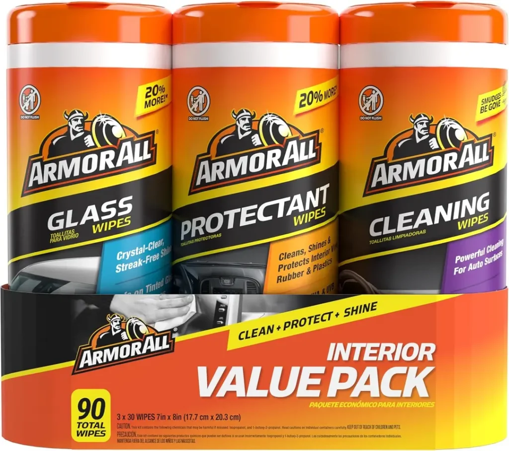 Armor All Protectant, Glass and Cleaning Wipes multi-pack with three canisters in a car's glove box