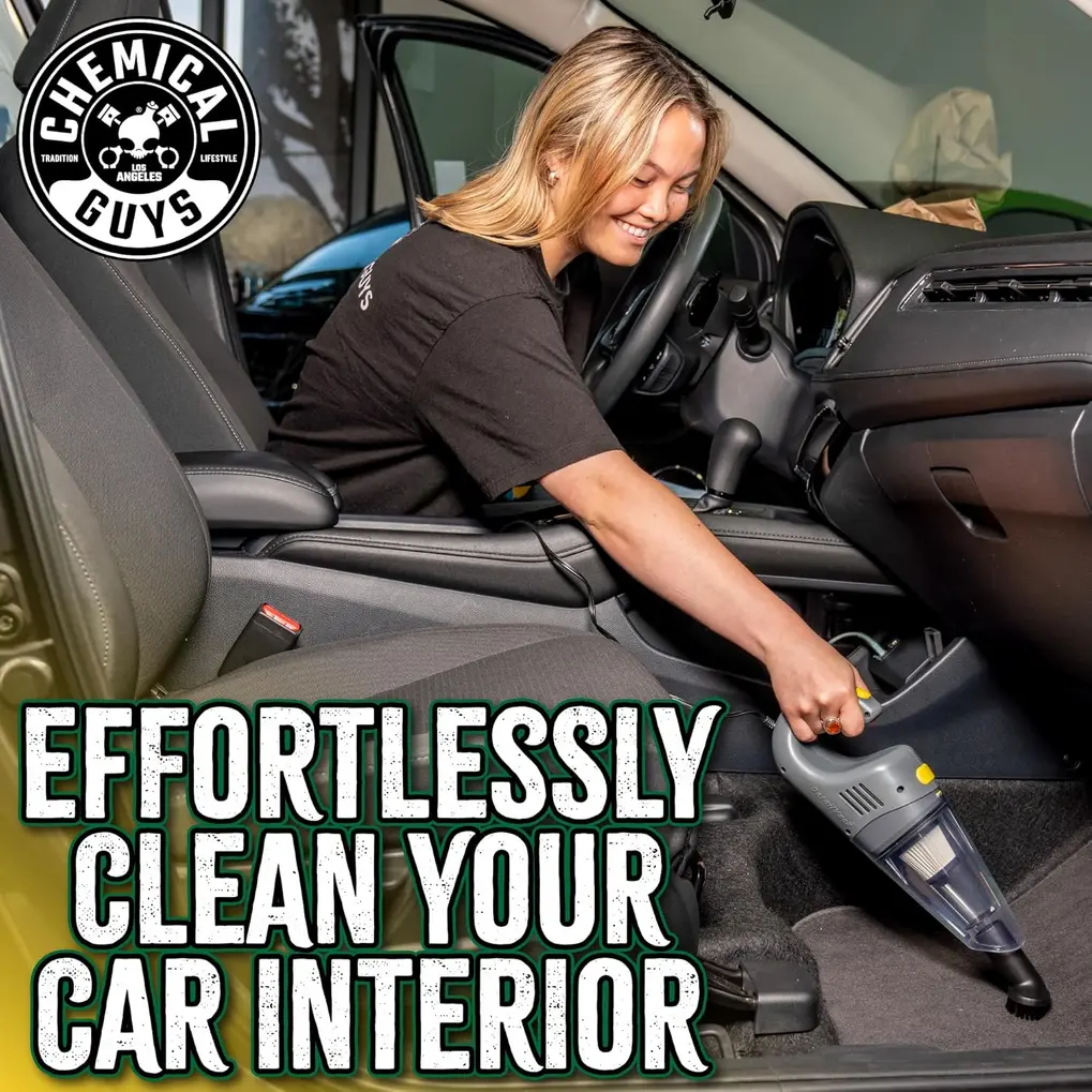 Chemical Guys EQP410 DetailVac being used to vacuum a car's footwell