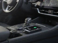 Jemluse Wireless CarPlay Adapter in a car's console.