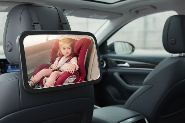 Shynerk Baby Car Mirror mounted on a car seat headrest.