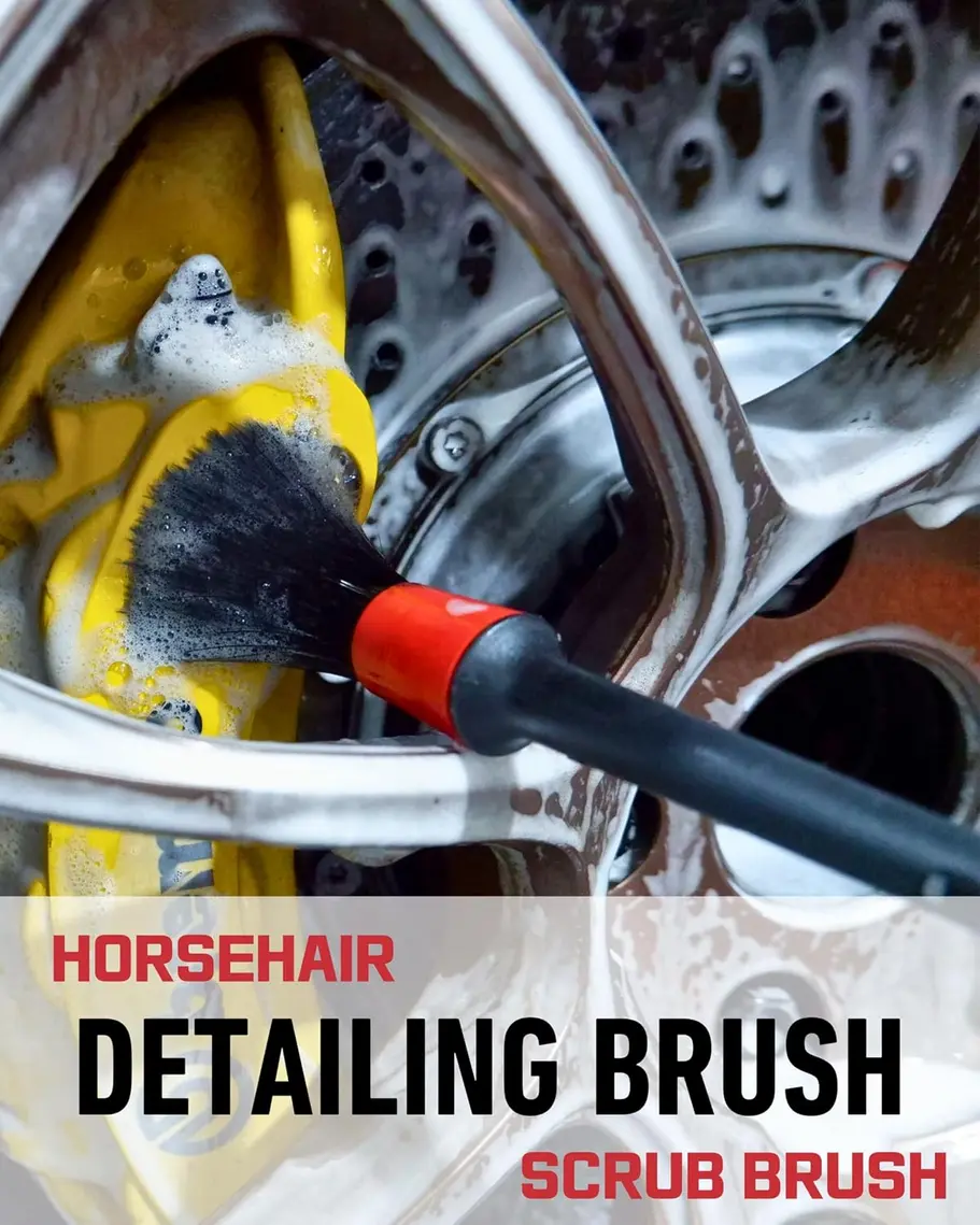 Oesee stiff tire brush removing dirt from a car tire tread