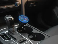 UYUXIO Car Charger Adapter in a car's cup holder, charging.