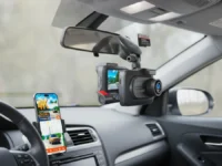ROVE R2-4K Dual Dash Cam in a car with its app on a phone.